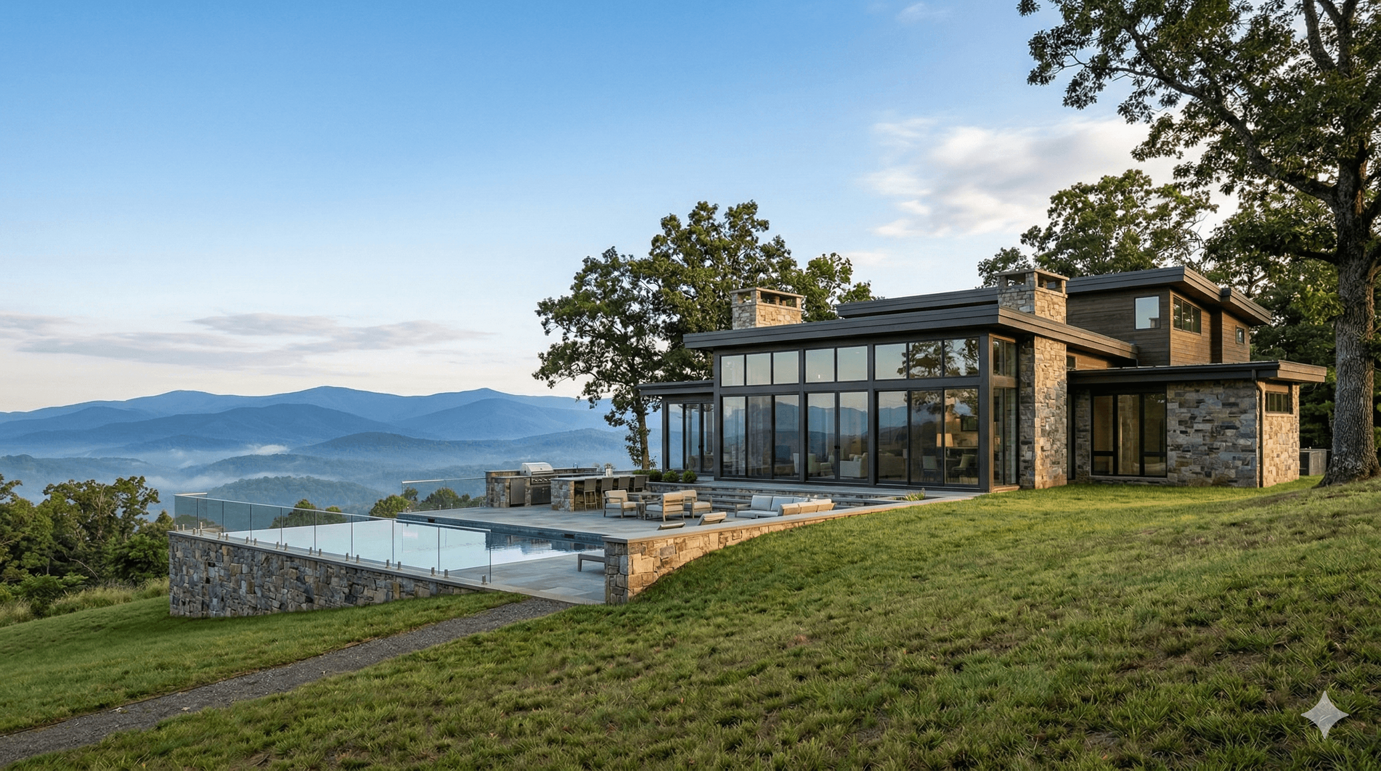 Modern custom home with stone and glass facade overlooking Blue Ridge Mountains at sunset