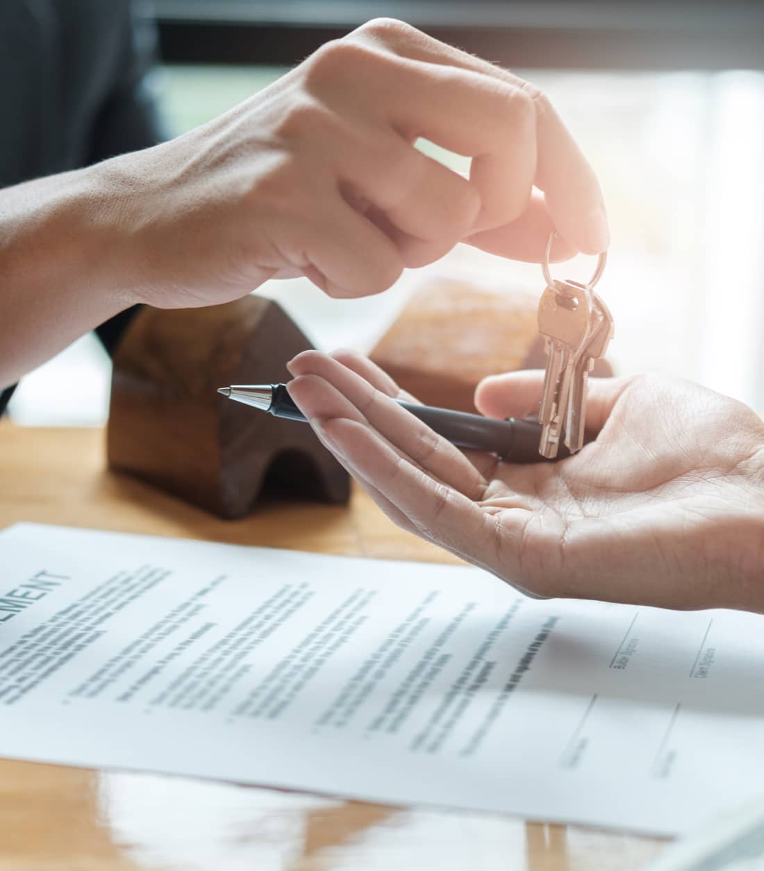 Keys being handed to new homeowner at closing