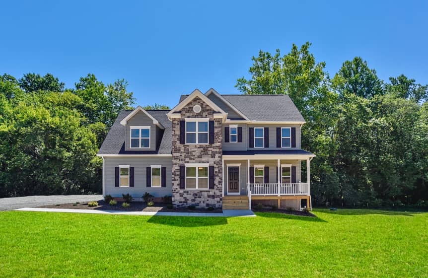 Completed custom home exterior with stone accents